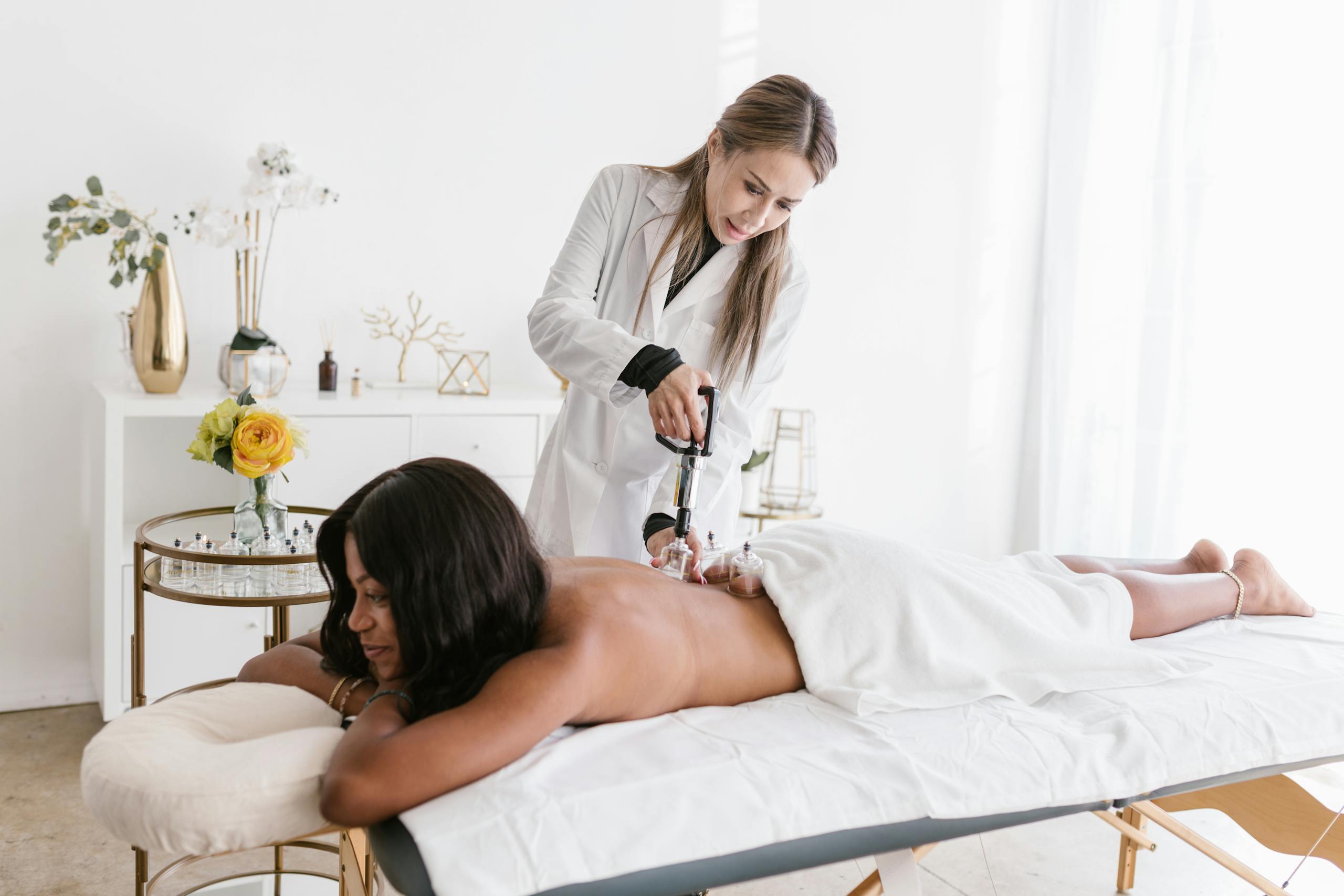 A Shirtless Woman Getting an Acupuncture